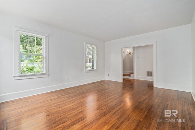 unfurnished room featuring wood-type flooring