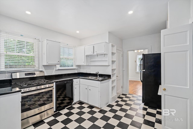 kitchen with white cabinetry, sink, and black appliances