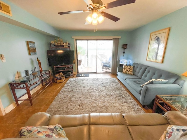 living room featuring tile patterned flooring and ceiling fan