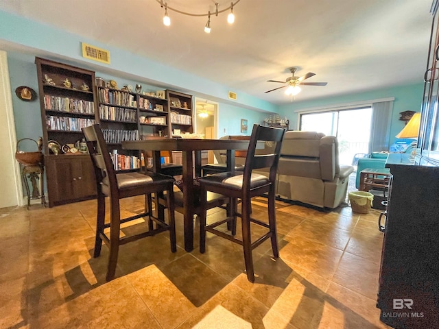 dining room featuring ceiling fan