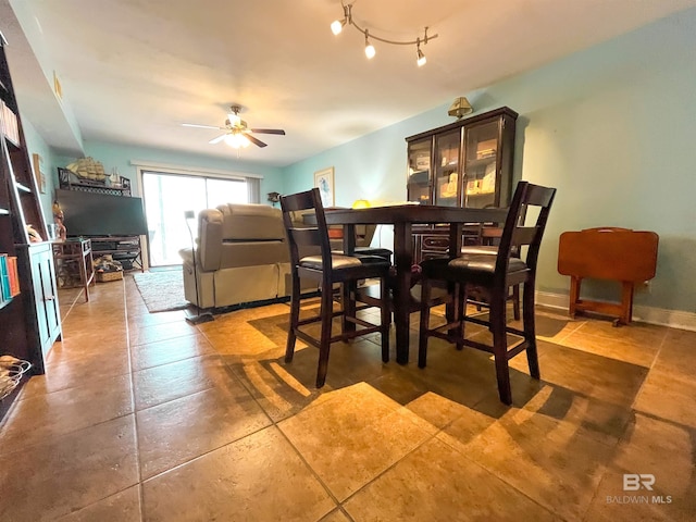 dining room featuring ceiling fan