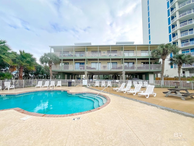 view of pool featuring a patio