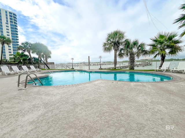 view of swimming pool featuring a patio