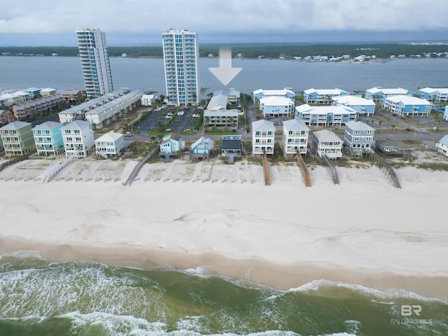 bird's eye view featuring a beach view and a water view