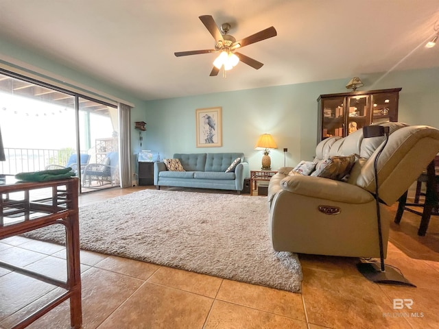 tiled living room with ceiling fan