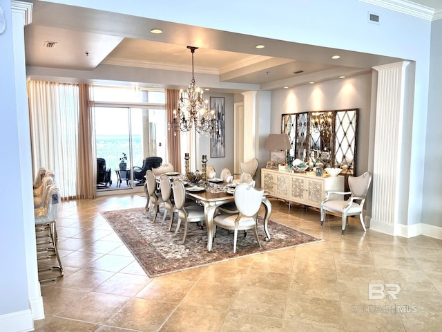 dining area featuring decorative columns, light tile patterned floors, a tray ceiling, a notable chandelier, and ornamental molding