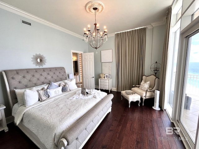 bedroom with an inviting chandelier, multiple windows, hardwood / wood-style flooring, and crown molding