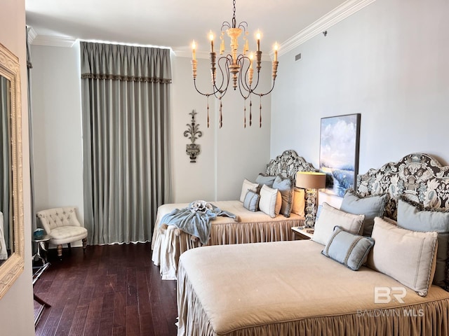 bedroom with an inviting chandelier, hardwood / wood-style flooring, and crown molding