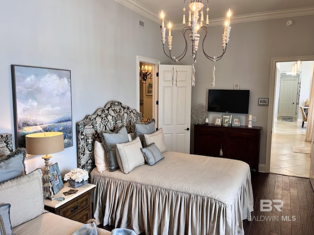 tiled bedroom featuring crown molding and a chandelier