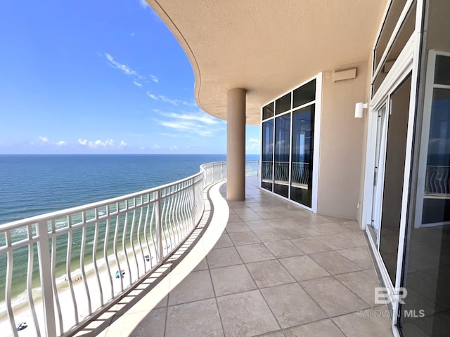 balcony featuring a water view