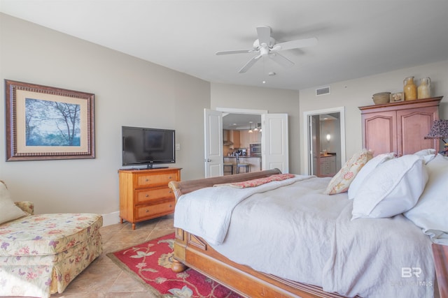 tiled bedroom with ceiling fan