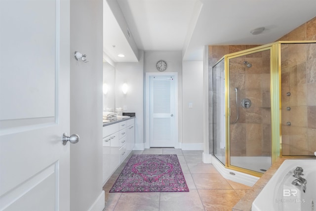 bathroom with tile patterned flooring, vanity, and an enclosed shower