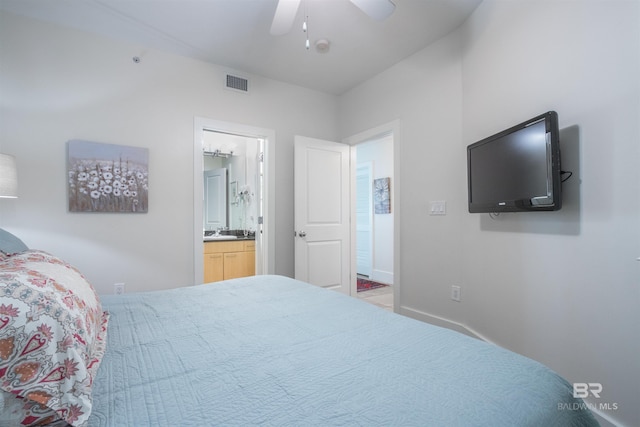 bedroom featuring ensuite bath, ceiling fan, and sink