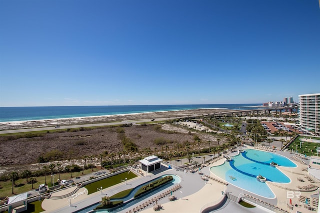 drone / aerial view featuring a view of the beach and a water view