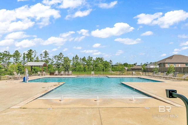 view of swimming pool with a gazebo and a patio area