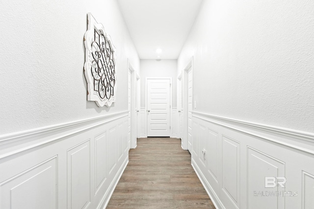 corridor with light wood-type flooring