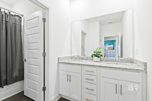 bathroom featuring vanity and hardwood / wood-style floors