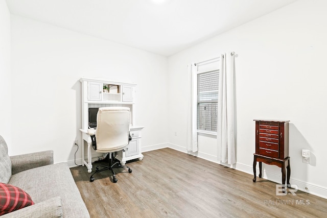 office space with light wood-type flooring