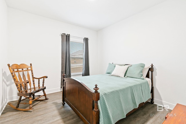 bedroom with hardwood / wood-style floors