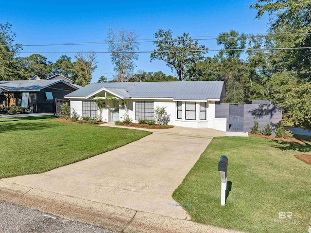 ranch-style home featuring a front yard