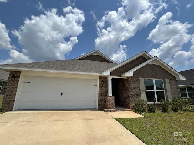 1311 Plymouth Dr, Foley, AL 36535 - view of front of property featuring driveway, brick siding, an attached garage, and a shingled roof