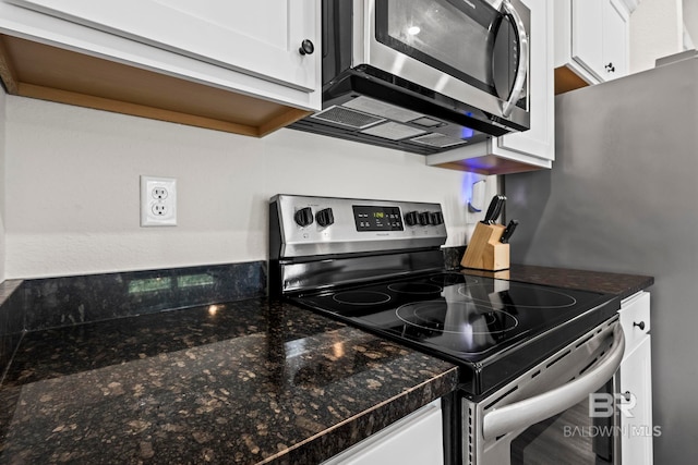 1311 Plymouth Dr, Foley, AL 36535 - kitchen featuring appliances with stainless steel finishes, white cabinetry, and dark countertops