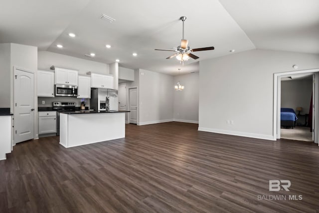 1311 Plymouth Dr, Foley, AL 36535 - kitchen with appliances with stainless steel finishes, lofted ceiling, ceiling fan, dark countertops, and recessed lighting