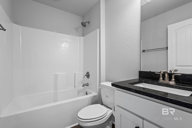 1311 Plymouth Dr, Foley, AL 36535 - full bathroom featuring toilet, vanity, a textured wall, and bathing tub / shower combination