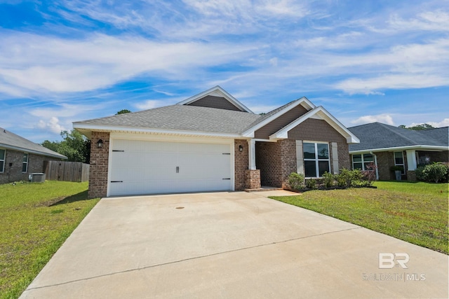 1311 Plymouth Dr, Foley, AL 36535 - view of front of home featuring brick siding, a garage, concrete driveway, cooling unit, and roof with shingles