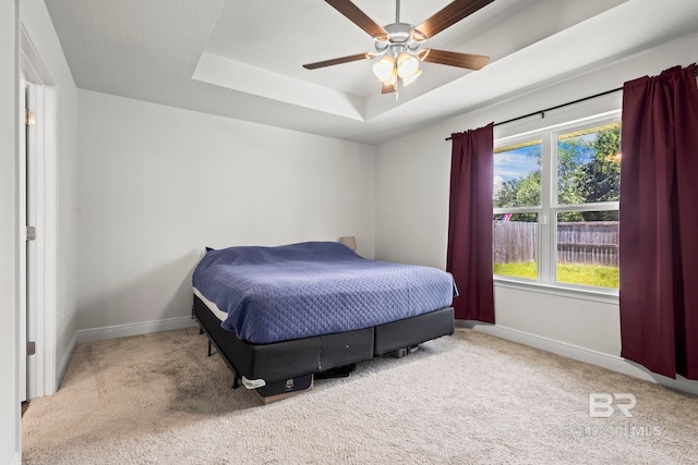 1311 Plymouth Dr, Foley, AL 36535 - bedroom featuring carpet floors, baseboards, a raised ceiling, and ceiling fan