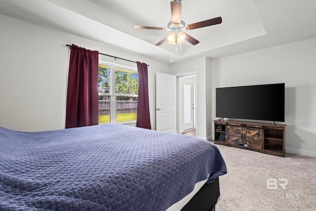 1311 Plymouth Dr, Foley, AL 36535 - carpeted bedroom with baseboards, a raised ceiling, and ceiling fan