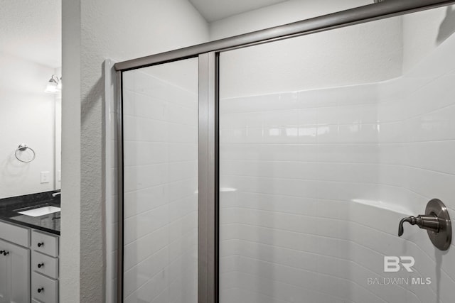 1311 Plymouth Dr, Foley, AL 36535 - full bath with a stall shower, vanity, and a textured wall