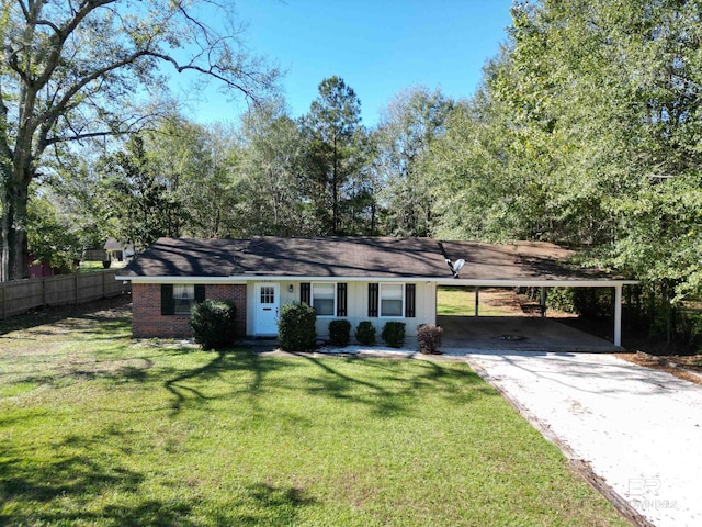 ranch-style home with a carport and a front lawn