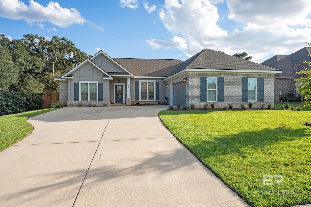 view of front of house with a garage and a front yard