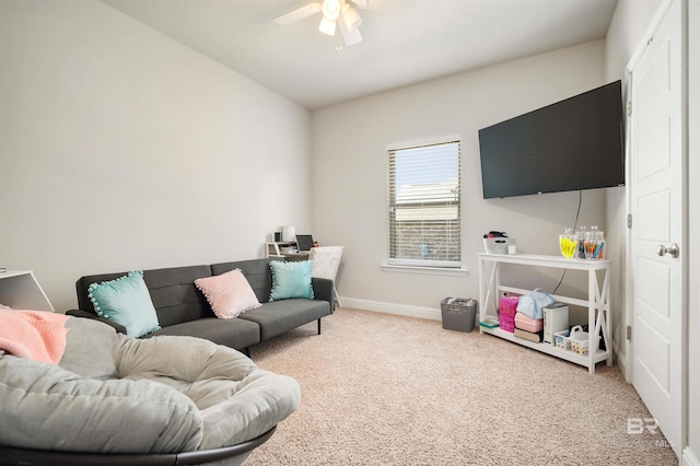 carpeted living room featuring ceiling fan