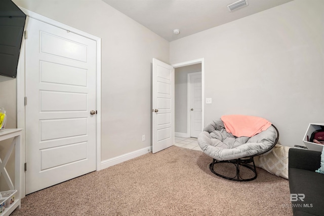 living area with light carpet