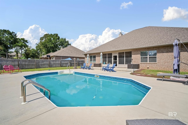 view of swimming pool with a patio area