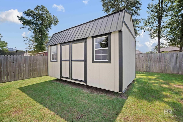 view of outbuilding featuring a yard