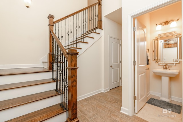 stairs with light wood-type flooring