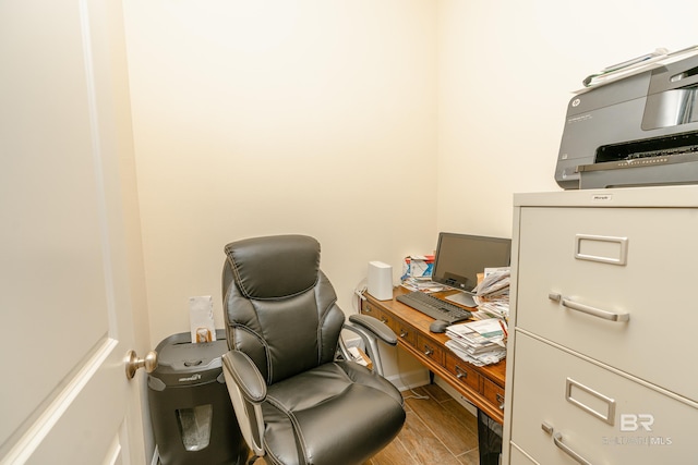 home office with wood-type flooring