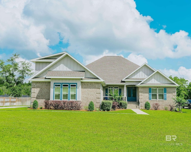 craftsman-style house with a front lawn