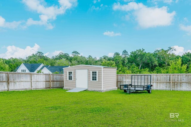 view of yard with a storage unit