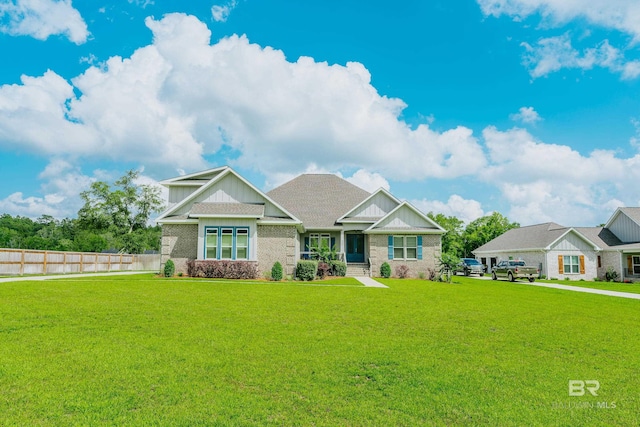 craftsman-style home with a front lawn