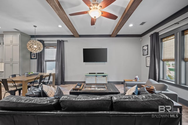 living room featuring beam ceiling, ceiling fan, and hardwood / wood-style floors