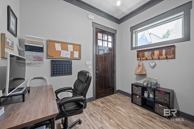 office space featuring wood-type flooring and crown molding