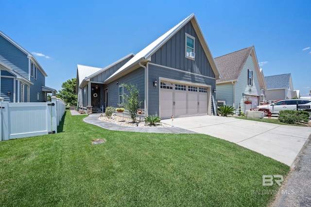 view of front of property with a garage and a front yard