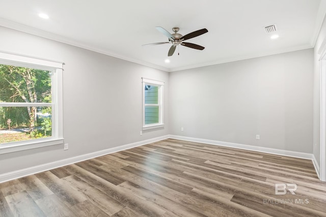 spare room featuring ceiling fan, ornamental molding, and hardwood / wood-style flooring