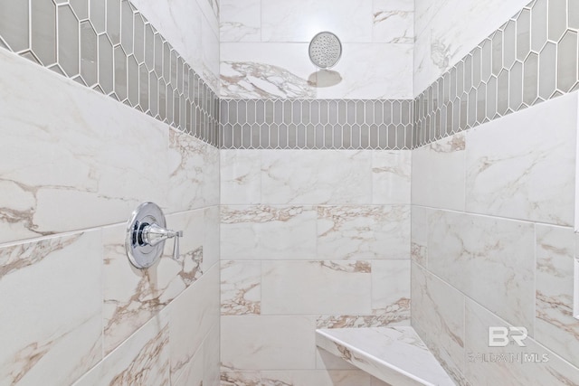 bathroom with tiled shower