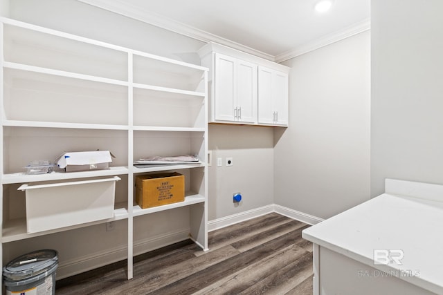 clothes washing area featuring cabinets, hookup for an electric dryer, ornamental molding, and dark hardwood / wood-style flooring