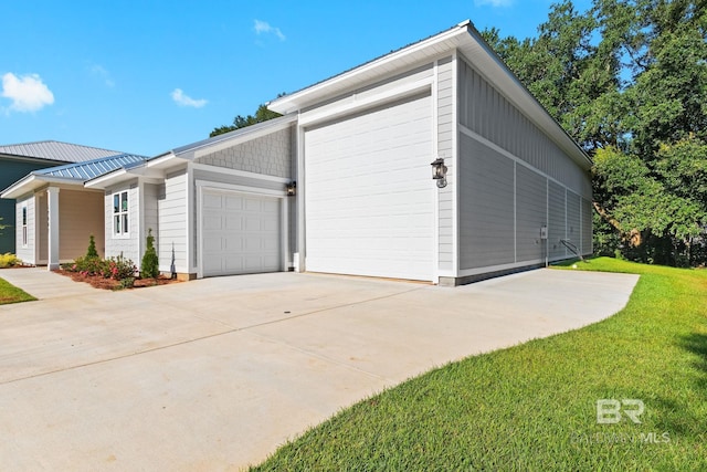 garage featuring a lawn